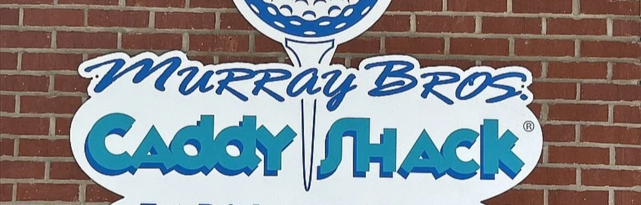 The Caddyshack logo on the side of the building.