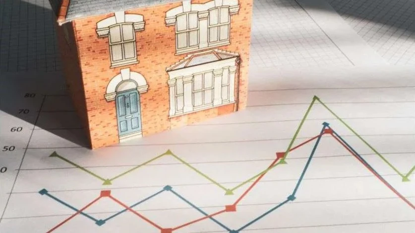An illustration of a home and lines on a graf, indicating the trend in housing affordability.