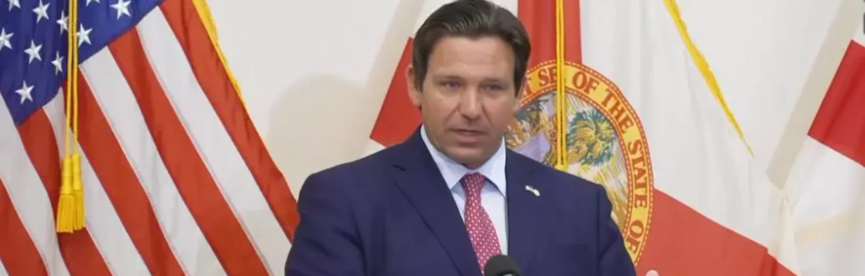 Gov. Ron DeSantis speaks at a lectern about property taxes.