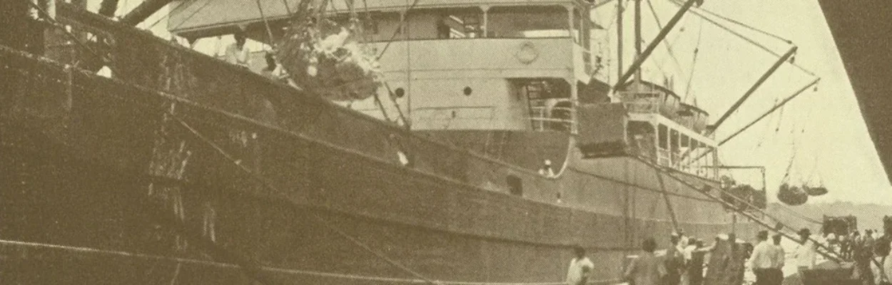 A ship on Jacksonville's working waterfront in a sepia-toned historic photo.