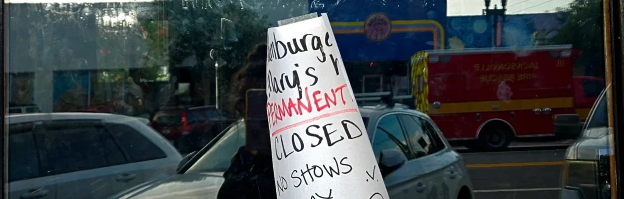 A sign on the door of Hamburger Mary's says the restaurant is permanently closed.