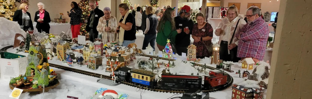 People wander around gingerbread creations at the Gingerbread Extravaganza.