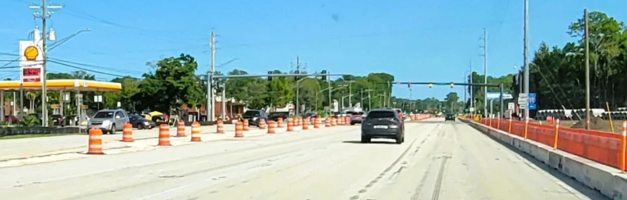 A view of the road with a car traveling at Butler Boulevard and Philips Highway.