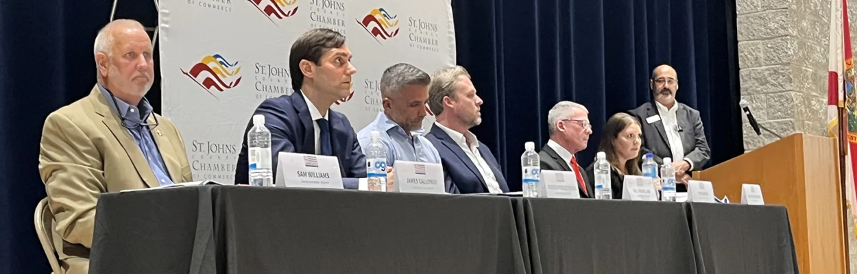St. Johns County Commission candidates sit at a table during a candidate forum.