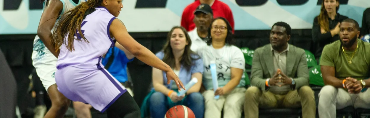 Jasmyne Roberts, in purple, backs down Rennia Davis, in white, in an Upshot League basketball game.