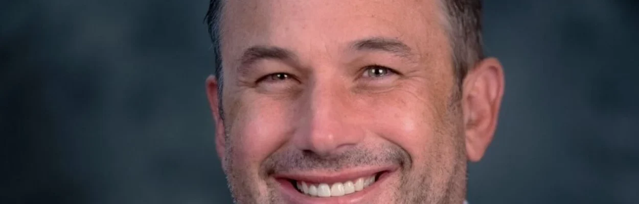 Portrait of Jake Gordon, CEO of Downtown Vision Inc.
