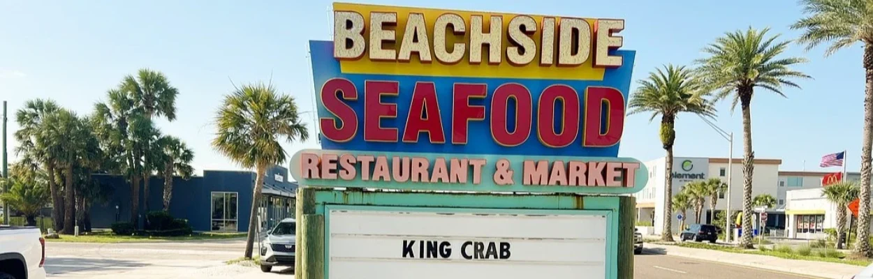The sign in front of Beachside Seafood Restaurant & Market