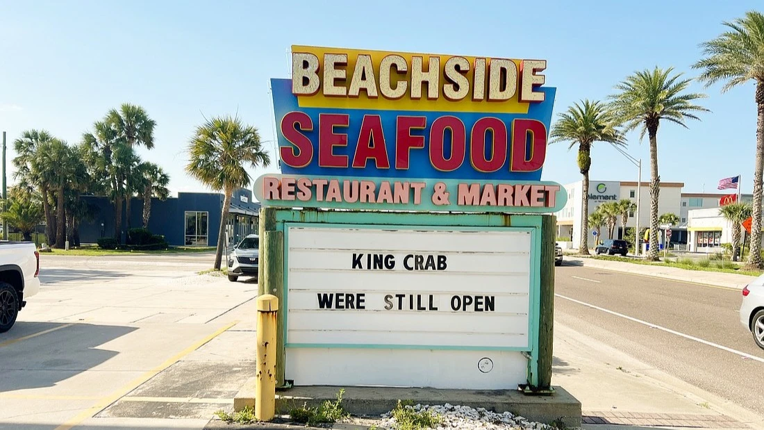 The sign in front of Beachside Seafood Restaurant & Market
