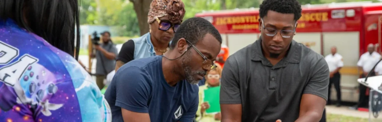 Laguerre family lights candles at Kings Road Memorial Park