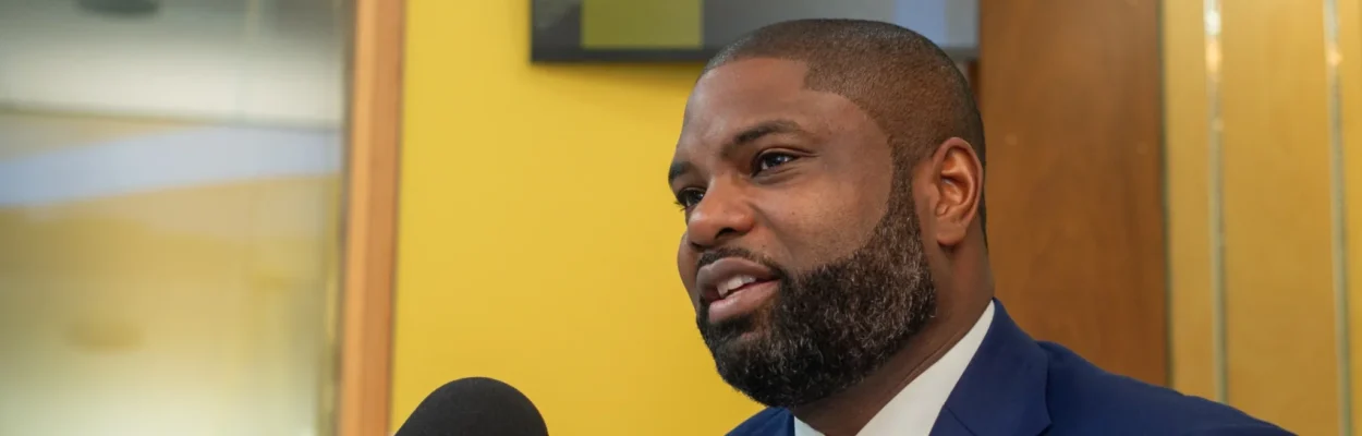 Rep. Byron Donalds is a Florida gubernatorial candidate. He is wearing a blue suit with a white shirt and blue tie ahead of an appearance on WJCT's First Coast Connect.