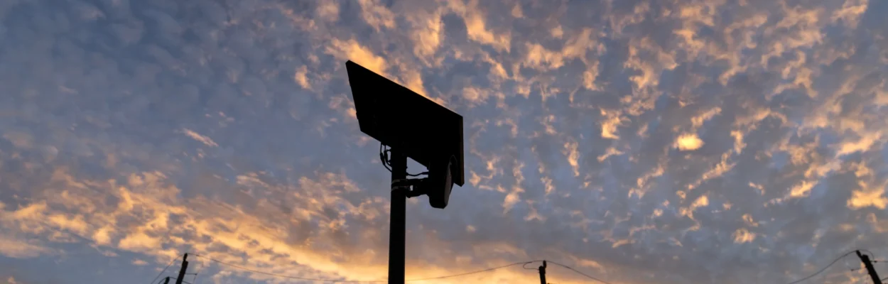 A Flock camera is shown against the sky.