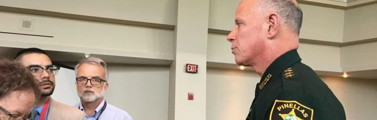 Pinellas County Sheriff Bob Gualtieri talks to reporters wearing his sheriffs uniform.