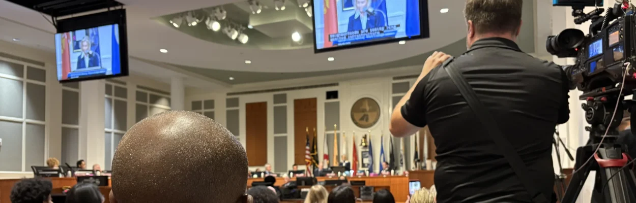 Audience members watch during a Jacksonville budget session