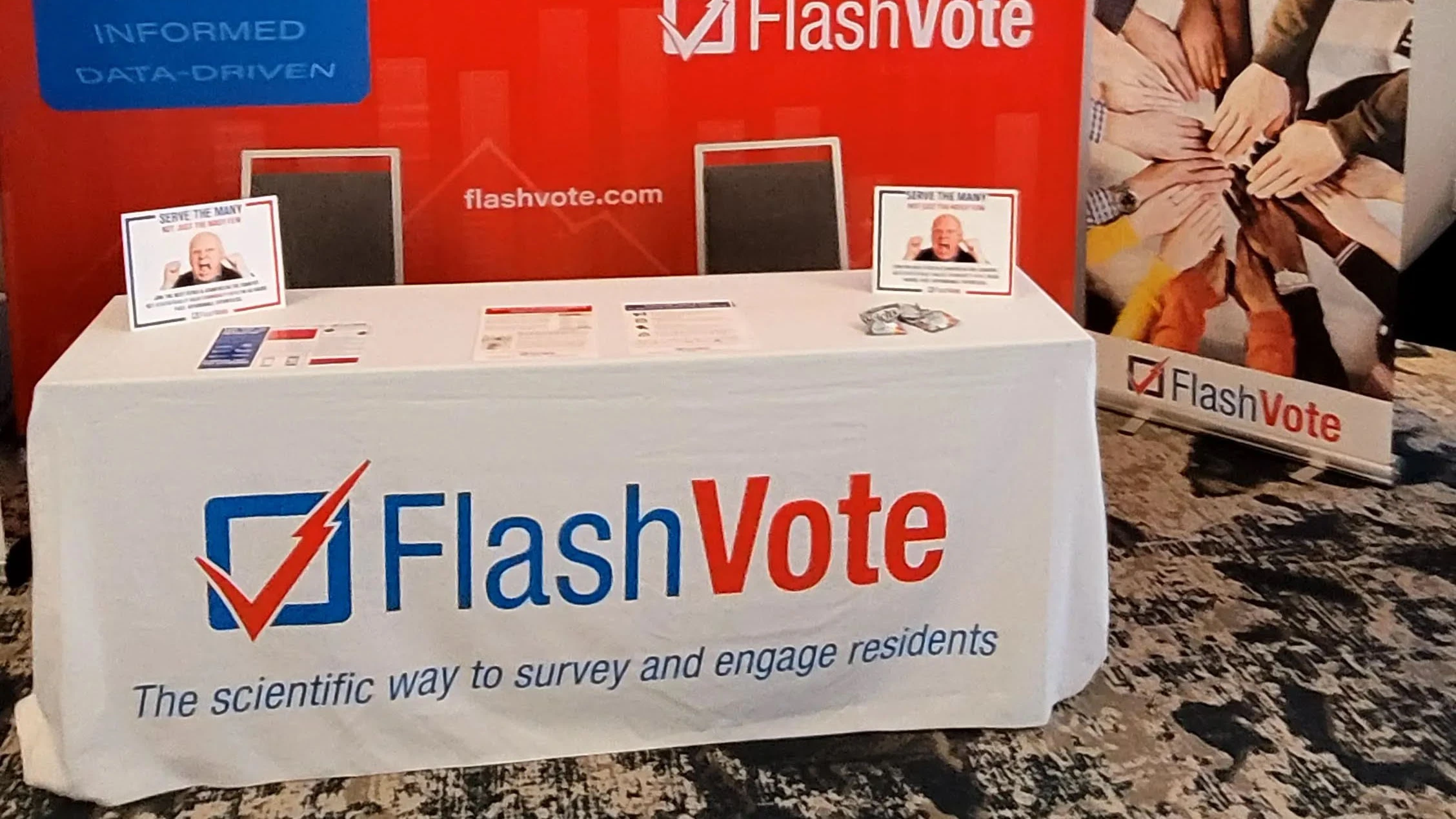 FlashVote advertised on a tablecloth at a conference