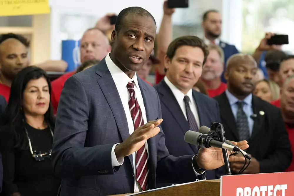 In this file photo, Florida Surgeon General Dr. Joseph Ladapo gestures as he speaks to supporters and members of the media before a bill signing by Gov. Ron DeSantis on Nov. 18, 2021, in Brandon.