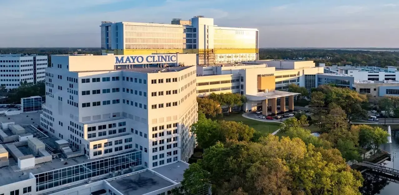 large while hospital building aerial with MAYO CLINIC written atop on of the structures in big lettering