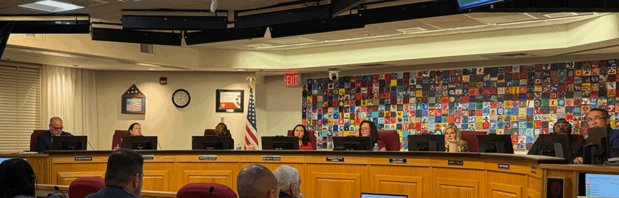 Duval School Board members sit at the dais during a meeting