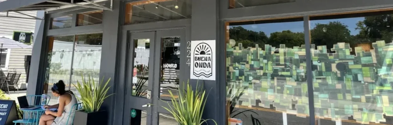 a woman dines outside Buena Onda on West King Street