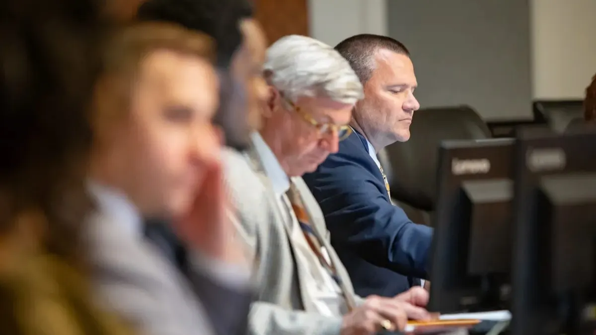 Jacksonville City Council member Will Lahnen sits in a meeting, preparing for a vote on Amendment 3.