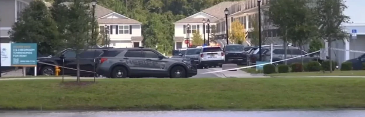 Police cars are shown outside the scene of a child's drowning.