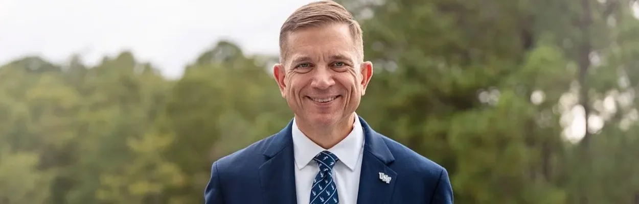 Portrait of Michael Shannon, in blue tie and blue sport coat, selected as the next president of the University of North Florida.