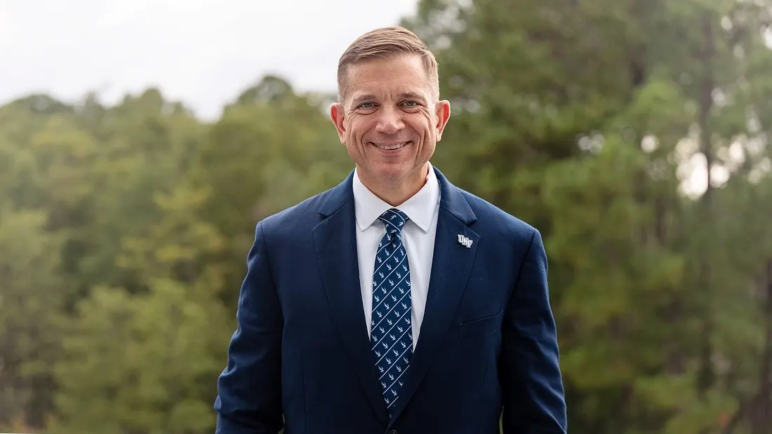 Portrait of Michael Shannon, in blue tie and blue sport coat, selected as the next president of the University of North Florida.