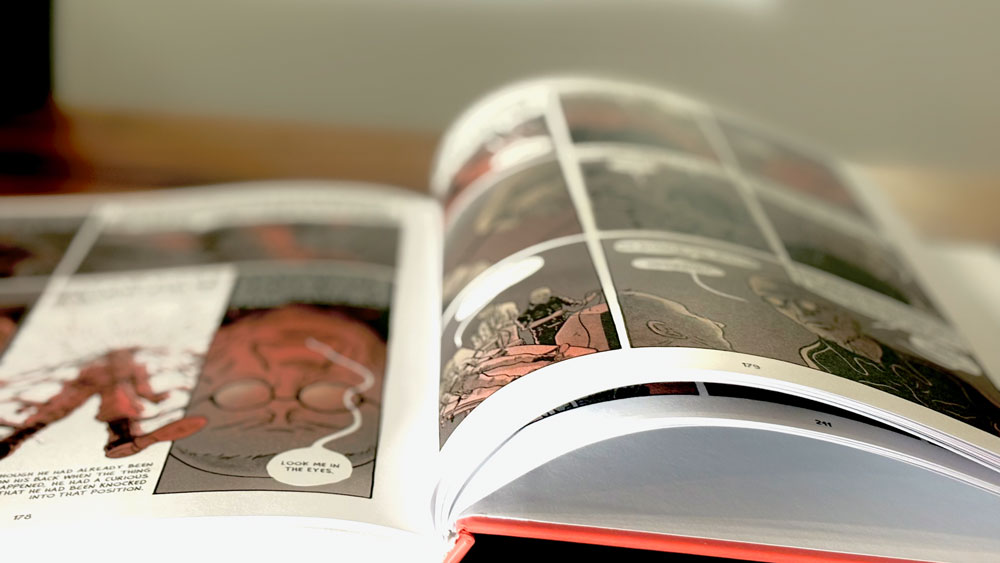 A copy of "1984: The Graphic Novel" opened on a table