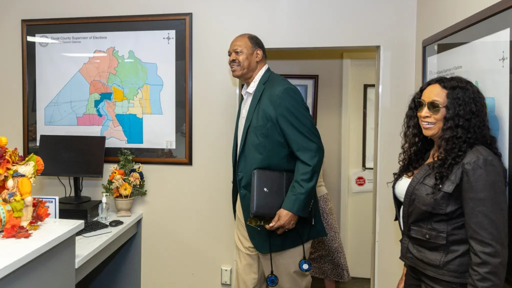 Enola Gay Gilmore wears a leather jacket inside the Duval County Supervisor of Elections Office. She is joined by her husband, Basketball Hall of Famer Artis Gilmore.