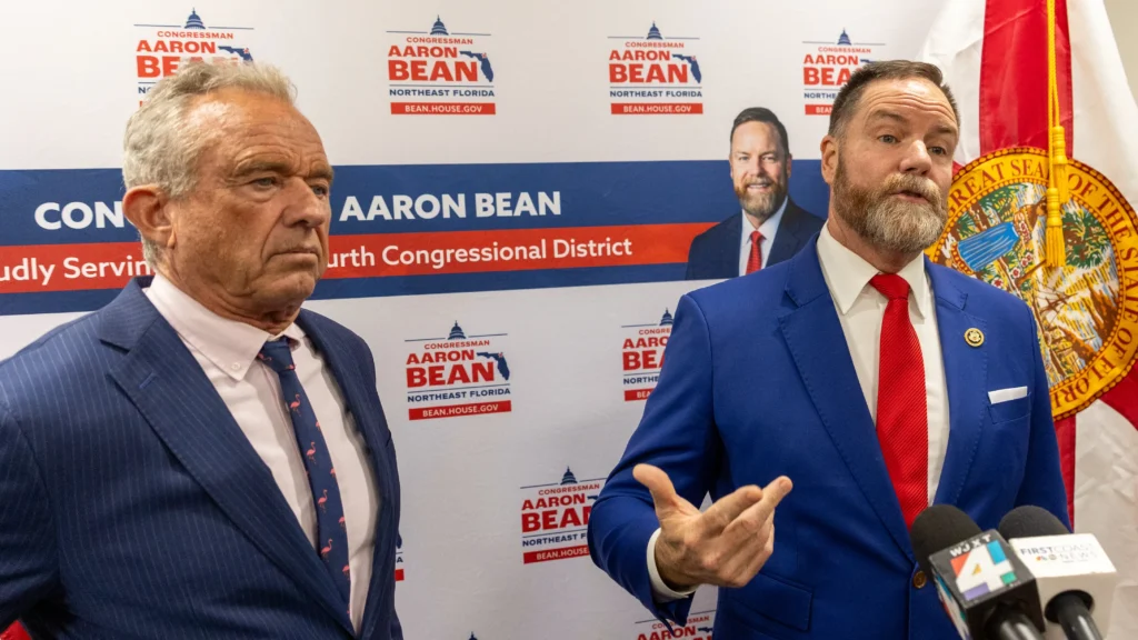 Department of Health and Human Services Secretary Robert F. Kennedy Jr. stands on the left next to Florida congressman Aaron Bean.