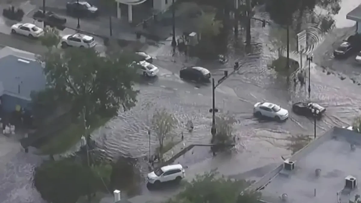 Overhead view of cars plowing through flooded streets in San Marco.