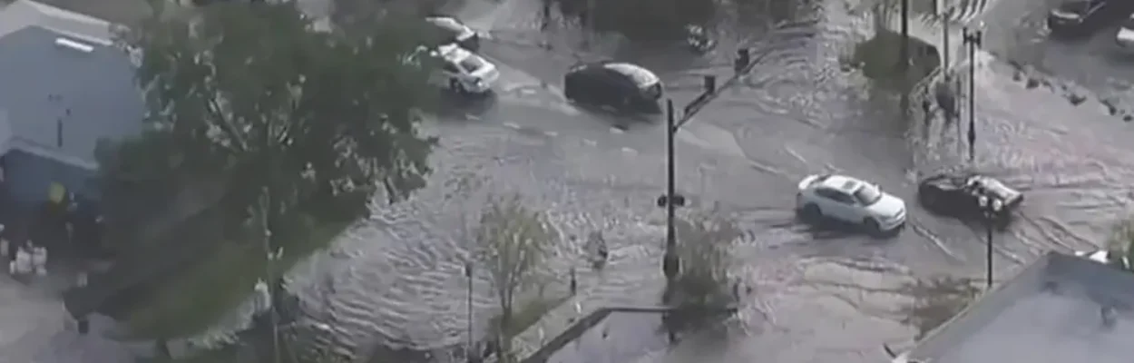 Overhead view of cars plowing through flooded streets in San Marco.