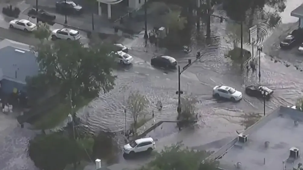 Overhead view of cars plowing through flooded streets in San Marco.