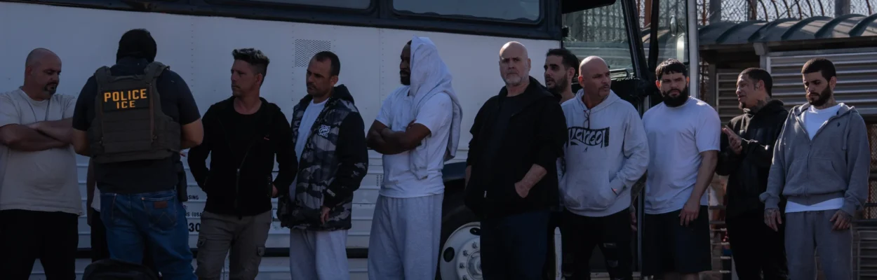 Immigration agents process dozens of migrants from Cuba and other countries.